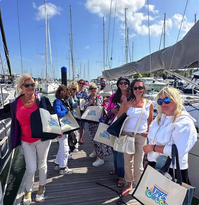 Travel specialists on a marina pontoon during a site visit