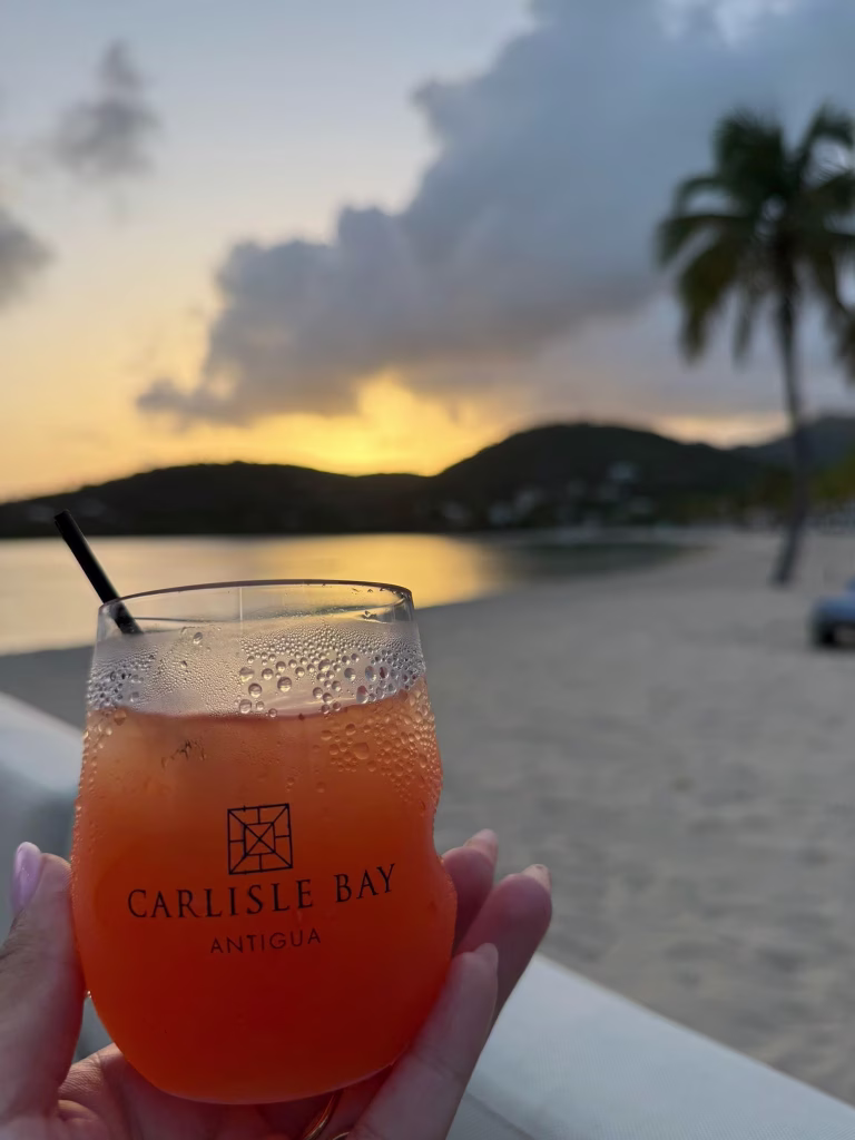 Rum punch at sunset on the beach at Carlisle Bay, Antigua