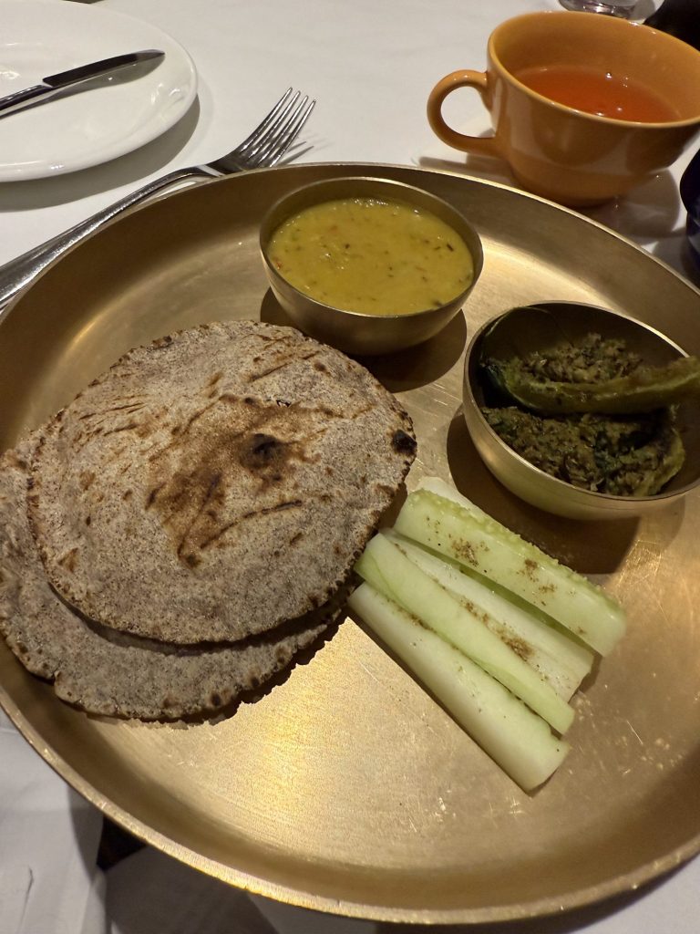 Ayurvedic thali with millet rotis, dal and cucumber at Ananda