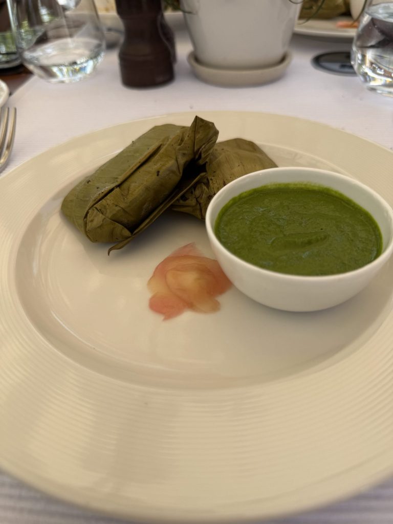 Leaf-wrapped dish with green chutney at Ananda in the Himalayas